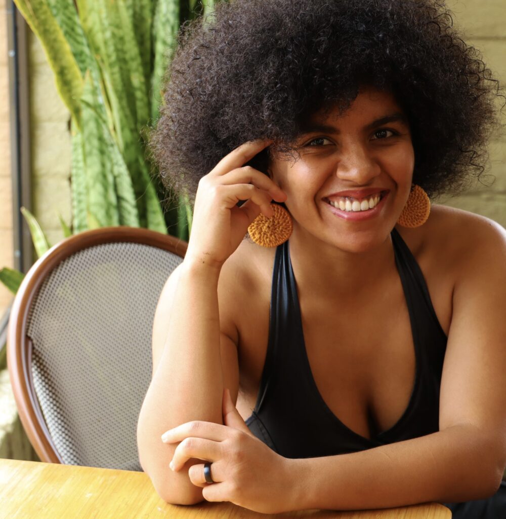 Sophie Denaud smiling while seated at a table